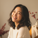 A candid portrait of a smiling young woman, conveying trust and happiness.